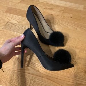 Black pumps with fur detail.